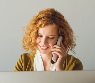 Businesswoman Speaking On The Phone At The Office Businesswoman Speaking On The Phone At The Office