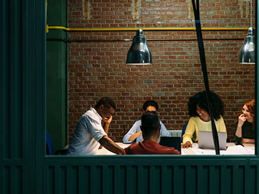 Team at work. Group of business people working and communicating together in creative office.